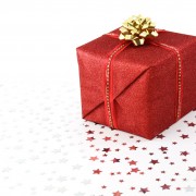 gift wrapped in red paper and gold bow