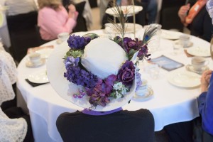 Guests wear turn-of-the-century style hats while enjoying their tea at the Jefferson County Library Foundation's Titanic Tea Party.